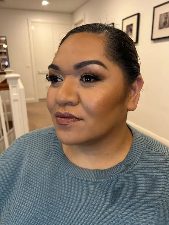 Lifted lash line with a deep brown crease and a nude-brown lip